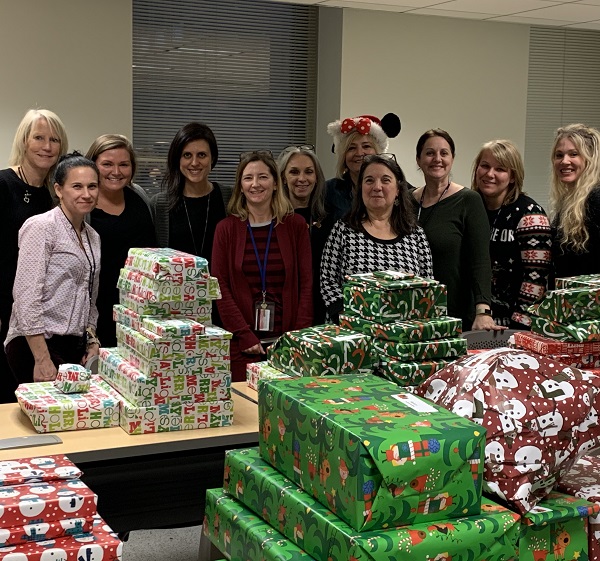 Faculty and staff getting together to wrap gifts